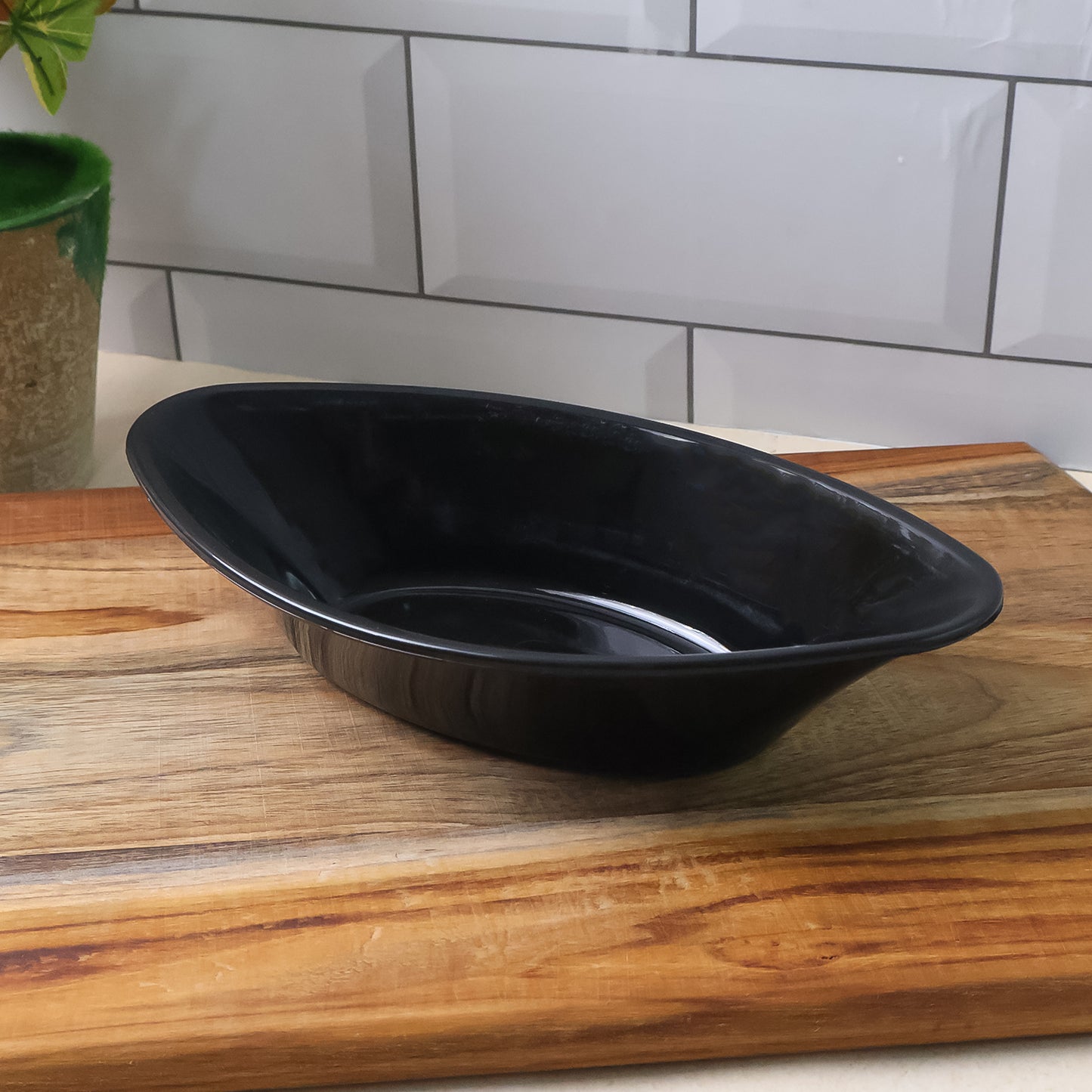 black oval plastic serving bowl 22 cm for salads and snacks